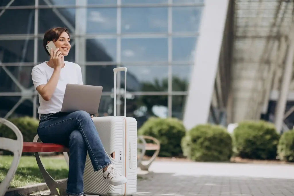 woman-travelling-working-computer-airport